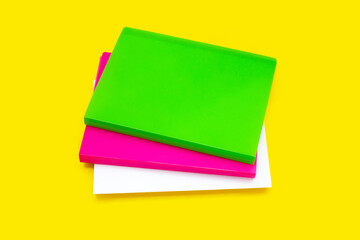 Office folders on yellow background.