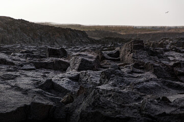 Volcanic rock black texture close up.