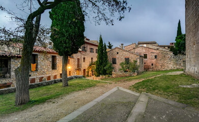Fototapeta na wymiar Stone houses of the beautiful town of Siurana at dusk, Province of Tarragona 