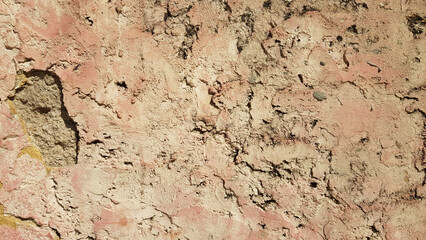 Yellowish wall texture with worn plaster.