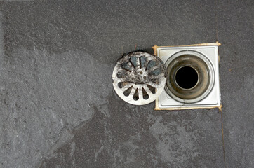 clogged pipe, anti-odor strainer with foul-smelling garbage in the bathroom