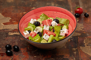 Traditional Greek salad on the wooden table