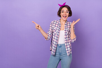 Photo of young girl excited indicate finger empty space way select promo advertise isolated over...