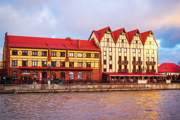 Naklejka premium Fishing village in Kaliningrad. Stylization of ancient Europe, lighthouse, ancient houses.