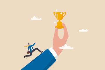 Motivation to achieve goal, reward or prize to motivate employee to succeed in work, effort and ambition to reach target concept, businessman run with full effort to reach trophy cup in giant hand.