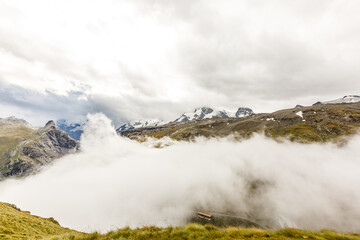 Panorama of cloud layer from mountain top over Swiss alps