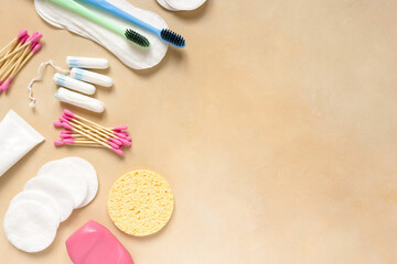 Flat lay of female personal hygiene items on beige background, space for text