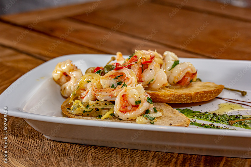 Poster Bruschetta with fried Mediterranean shrimp and sauce