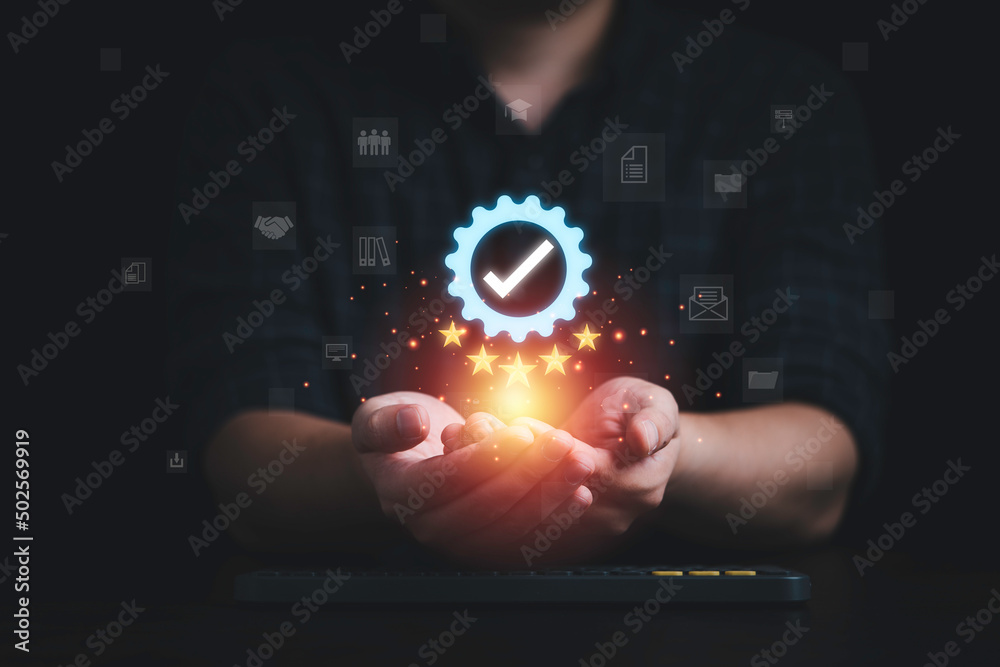 Poster businessman holding and showing the best quality assurance with golden five stars and icons for guar