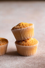 Sweet muffins with powdered sugar. Homemade bakery. Muffins in capsules.