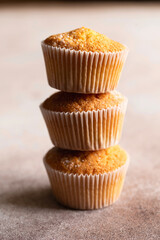 Sweet muffins with powdered sugar. Homemade bakery. Muffins in capsules.
