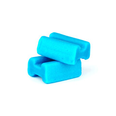 chewing gum on white background. two pieces of blue gum