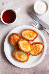 Fluffy Flapjack Pancakes. Fried Pancakes with sour cream and jam. Healthy traditional breakfast. Children's menu. Fluffy pancakes recipe. Flat lay