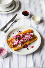 Fried Stuffed Pancakes Blintzes. Russian thin pancakes with cottage cheese, sour cream and jam. Healthy traditional breakfast.Tasty stuffed pancakes crepes with fillings. Kid's menu.