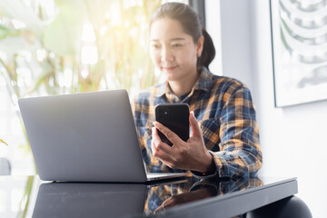 woman work using texting cell phone typing computer.student study education online learning.adult professional chatting on laptop,mobile contact us at Thinking business plan.connecting people concept