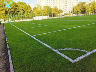 Artificial grass soccer field. Corner kick line of ball and a soccer field , football field ,...