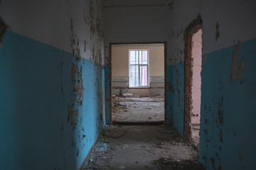 
Abandoned building. A beautiful and scary corridor with shabby walls. Interior of an old abandoned building