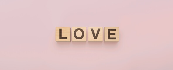 Wooden cubes with word Love on pink background. love letters on wood block for your girlfriend, boyfriend, for Valentines Day greeting romantic postcard