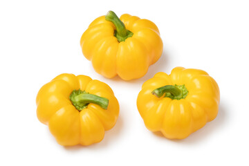  Fresh picked yellow bell peppers close up isolated on white background