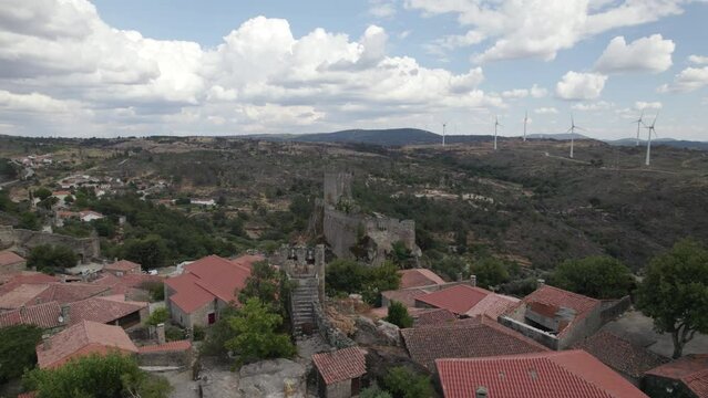 Ancient Sortelha Fortress on bluff overlooking countryside; aerial pan