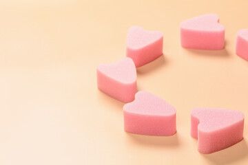 Soft tampons stringless in circle on pink background. New generation. Freedom of movement for girls and women.