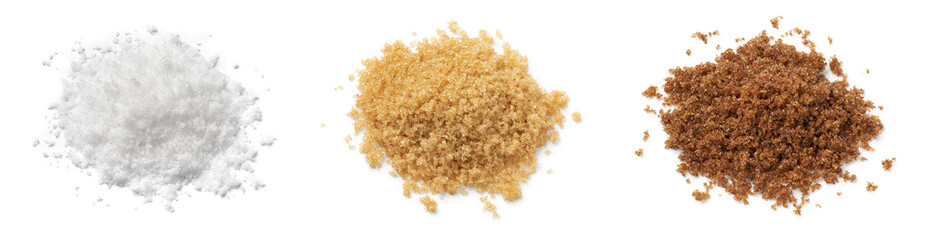 Heap of soft dark brown, light brown and white sugar close up isolated on white background