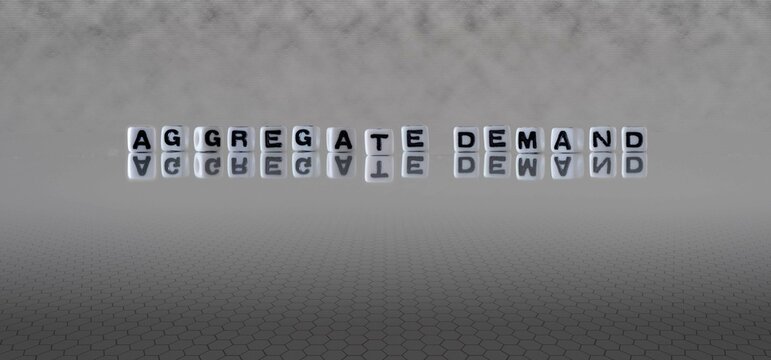 aggregate demand word or concept represented by black and white letter cubes on a grey horizon background stretching to infinity