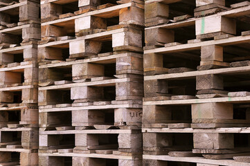 Old wooden pallets. Warehouse outside.