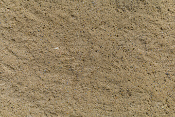 Beige yellow sandstone background, natural sand rock textured surface