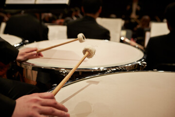 Fototapeta na wymiar Close-up of hands playing timpani