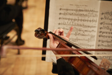 Close-up of musician hands playing the violin