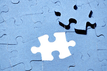 The missing piece of the puzzle with light, the concept of completing a big job, the final of the...