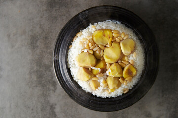 Ripe chestnut topping on cast iron pot rice