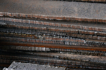 Close-up of sheet metal cut. Iron for construction. Metal. Raw materials for metallurgical industry. Background.