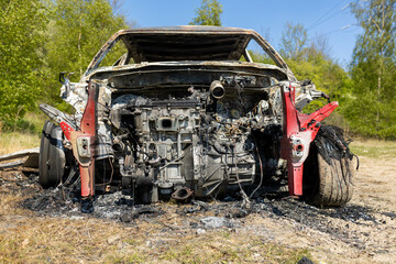 Newburn UK: 29th April 2022: A stolen car which has been burnt out and dumped in a field