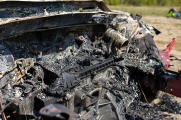 Newburn UK: 29th April 2022: A stolen car which has been burnt out and dumped in a field