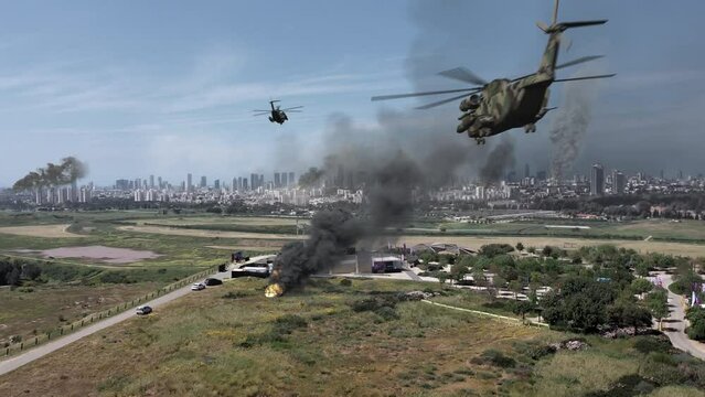 Large city under massive attack with destroyed buildings, aerial
Drone view over Tel aviv city bombarded with smoke rising and helicopters, israel,2022

