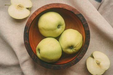 apples on a wooden bowl