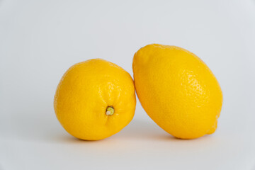 Close up view of lemons on white surface