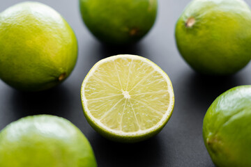 Obraz na płótnie Canvas Close up view of half of lime on black background