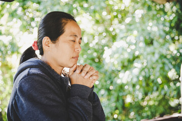 portrait of a young woman praying