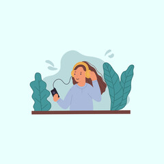 young girl wearing headphone and listening music