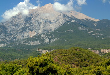 Obraz premium View of Tahtalı mountain, which is slightly obscured by clouds near the town of Kemer, Antalya region, Turkey