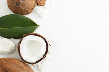 Coconut on white background. Home spa treatment concept, organic cosmetic. Copyspace.