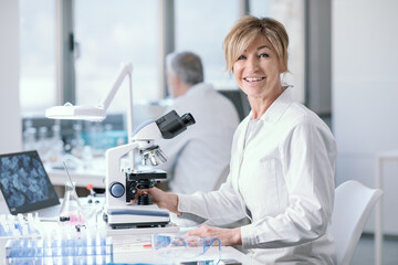 Smiling researcher working in the lab