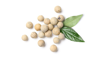 Flat lay of white peppercorns (white pepper) with leaf isolated on white background.