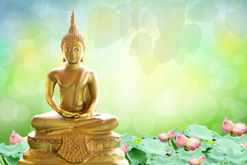 Buddha statue. background blurred flowers and sky with the light of the sun.Makha Bucha Day.Vesak...