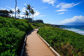 Oneloa Beach along the Kapalua Coastal Trail on West Maui, Hawaii - Boardwalk winding between luxury resorts and the Pacific Ocean