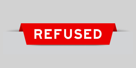Red color inserted label with word refused on gray background