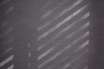 Top view flat lay background with organic shadows, bokeh, and texture on a lilac colored kraft paper background. Minimal summer lights and shadow concept.